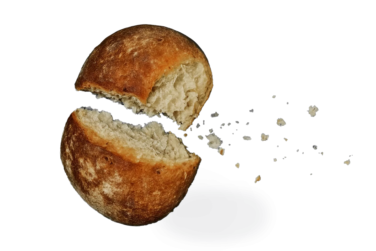 Round loaf of bread halved, crumbs scattered on white background.